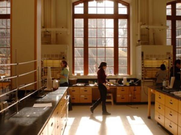 Person walking through a room with a large window