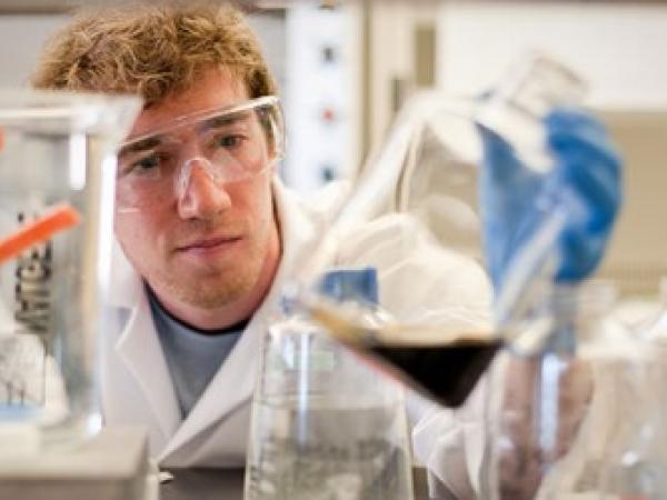 Person in a lab wearing safety equipment