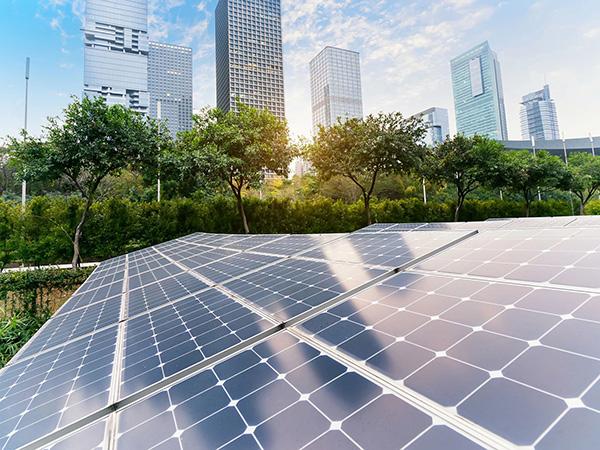 Solar panel in front of a cityscape