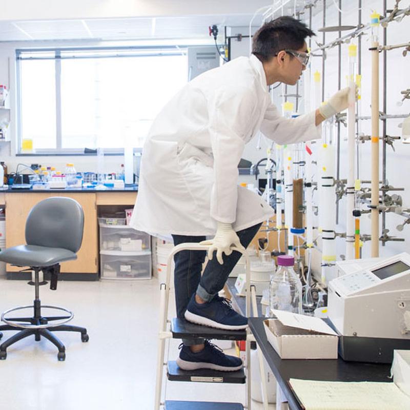 Person working in a chemistry lab environment